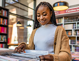 young woman shopping for records
