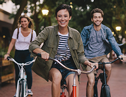 group of young adults riding bikes