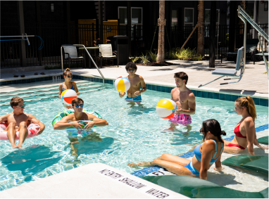 A group of young people enjoying the pool.
